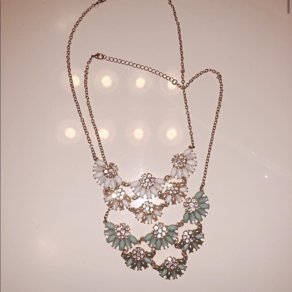Floral necklaces both with gold chain